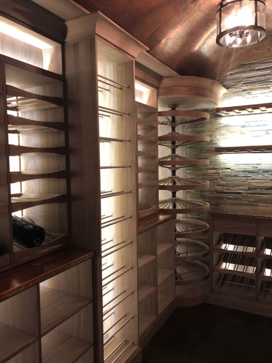 Wine cellar with multiple storage solutions by Reve Custom Wine Cellar