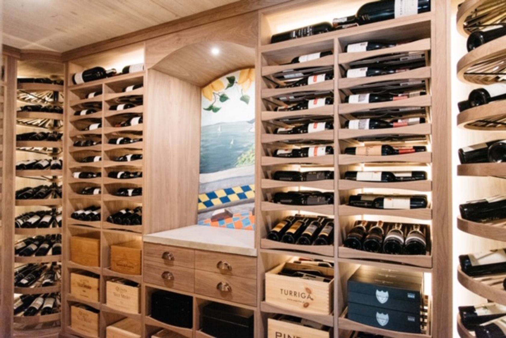 Wine cellar focal point with storage drawers and counter top