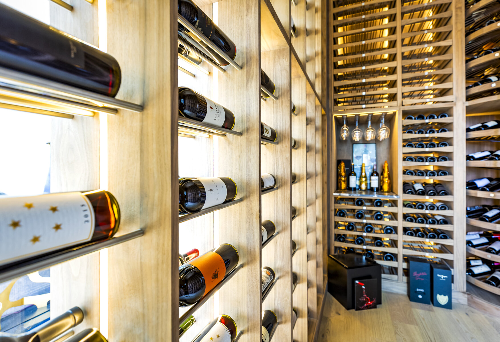 Bespoke 12-foot-high vertical wine racking system maximizing space in a luxury penthouse.