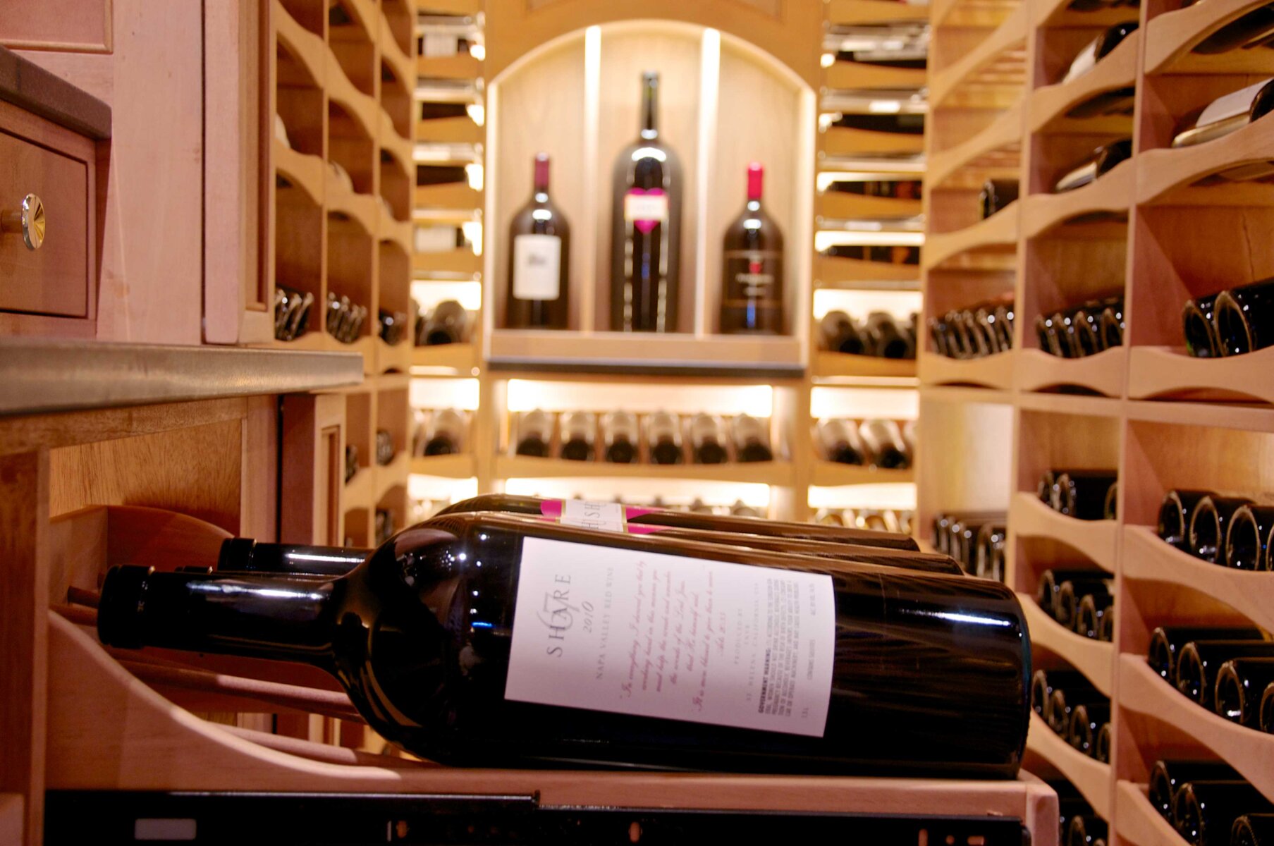 Dedicated luxury wine cellar alcove designed to house 100-point collectible wines.