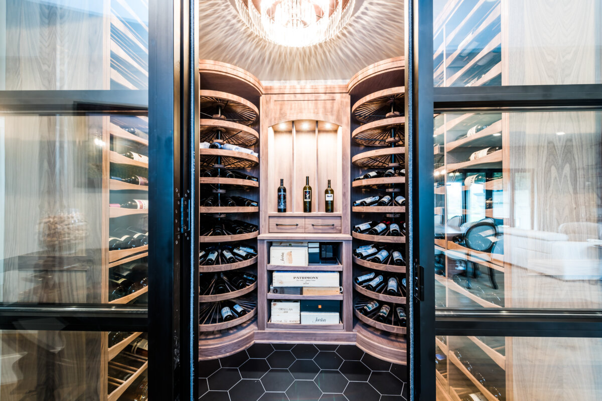 Custom walnut wine cellar with a glass entry
