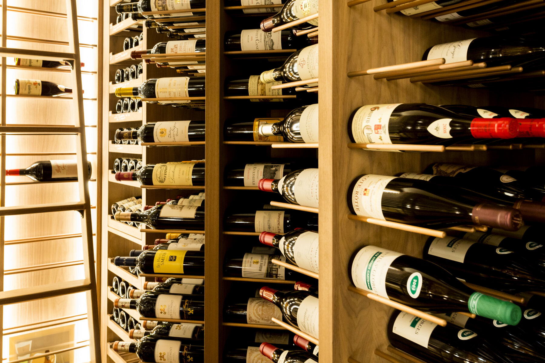 close up of rotating wine storage towers with copper plating
