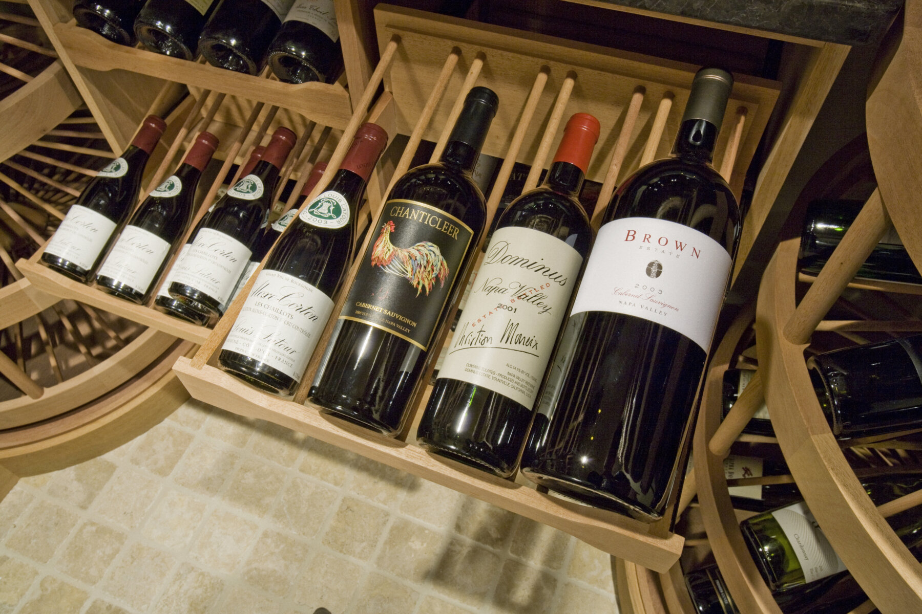 Pullout drawers showing how wine bottles of multiple sizes can all fit together