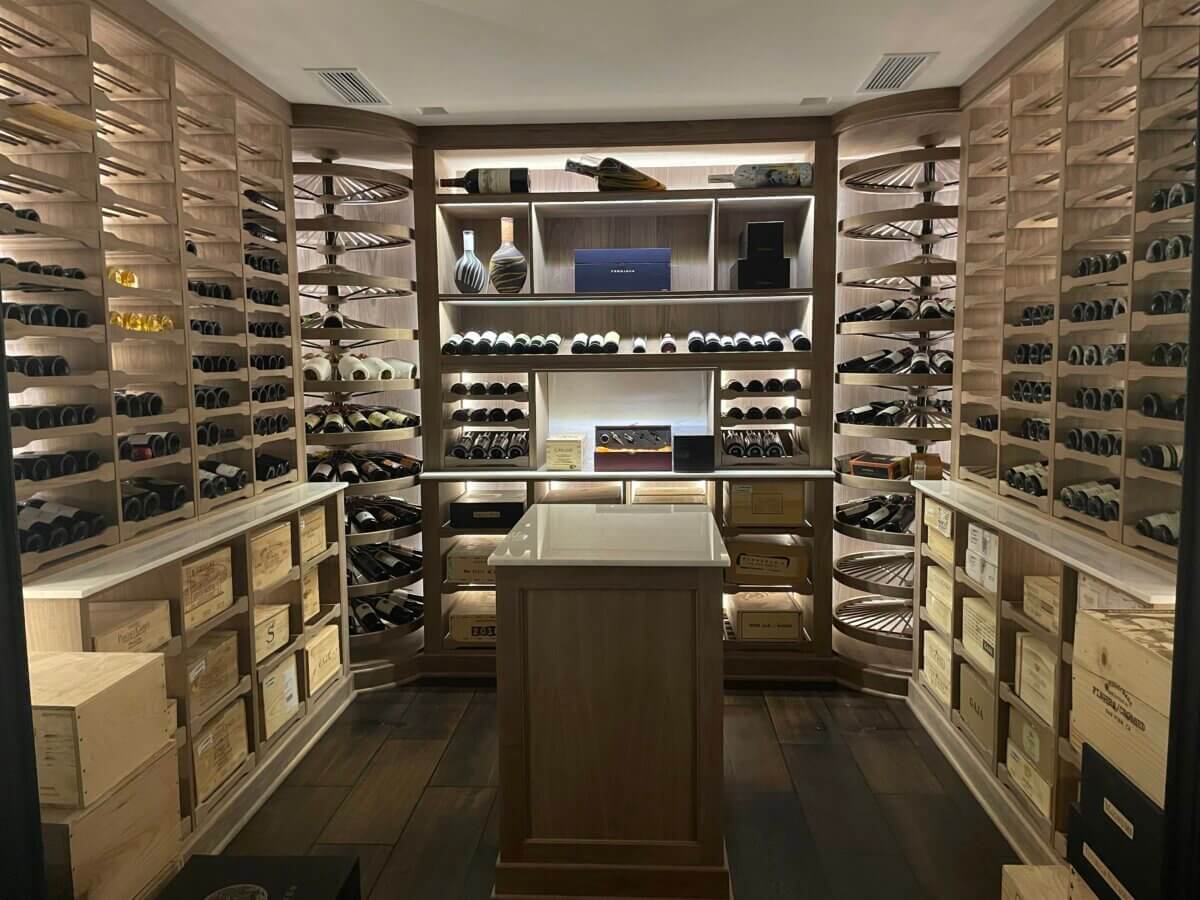 Finished custom wine cellar by Revel Custom Wine Cellars with ceiling grilles
