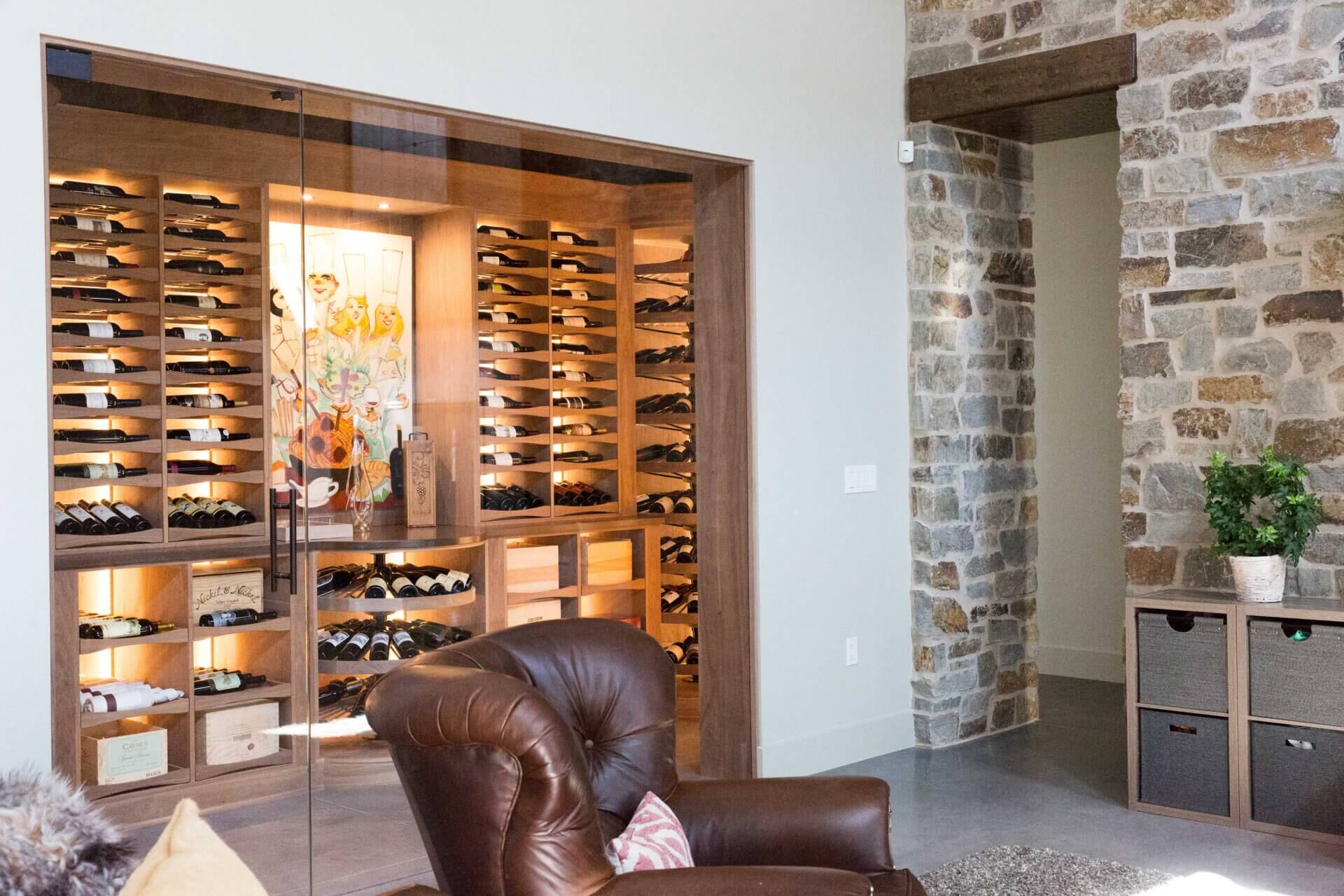 Glass enclosed wine cellar off of living room